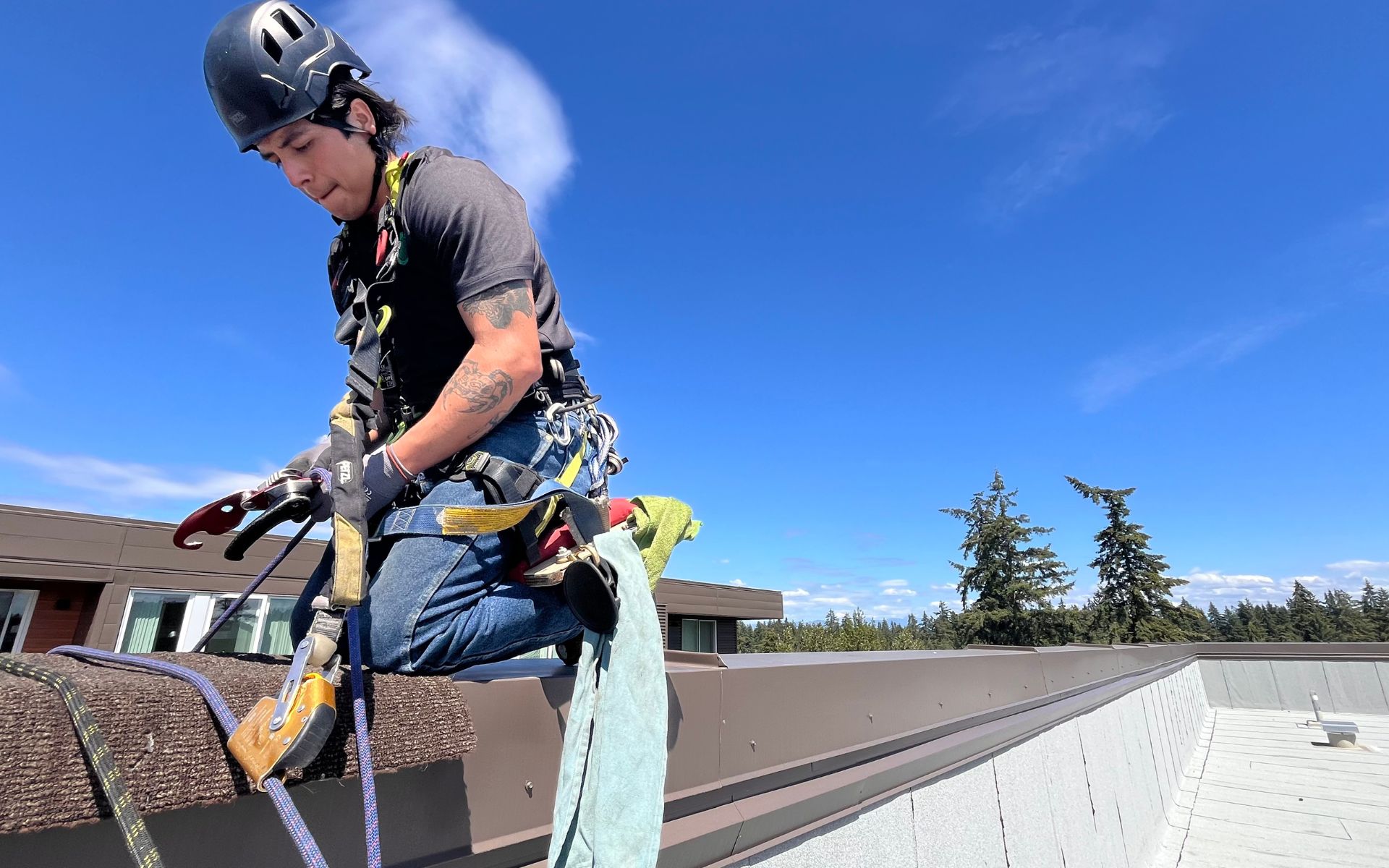 Chimera Rope Access Employee Climbing Over the Side of the Building